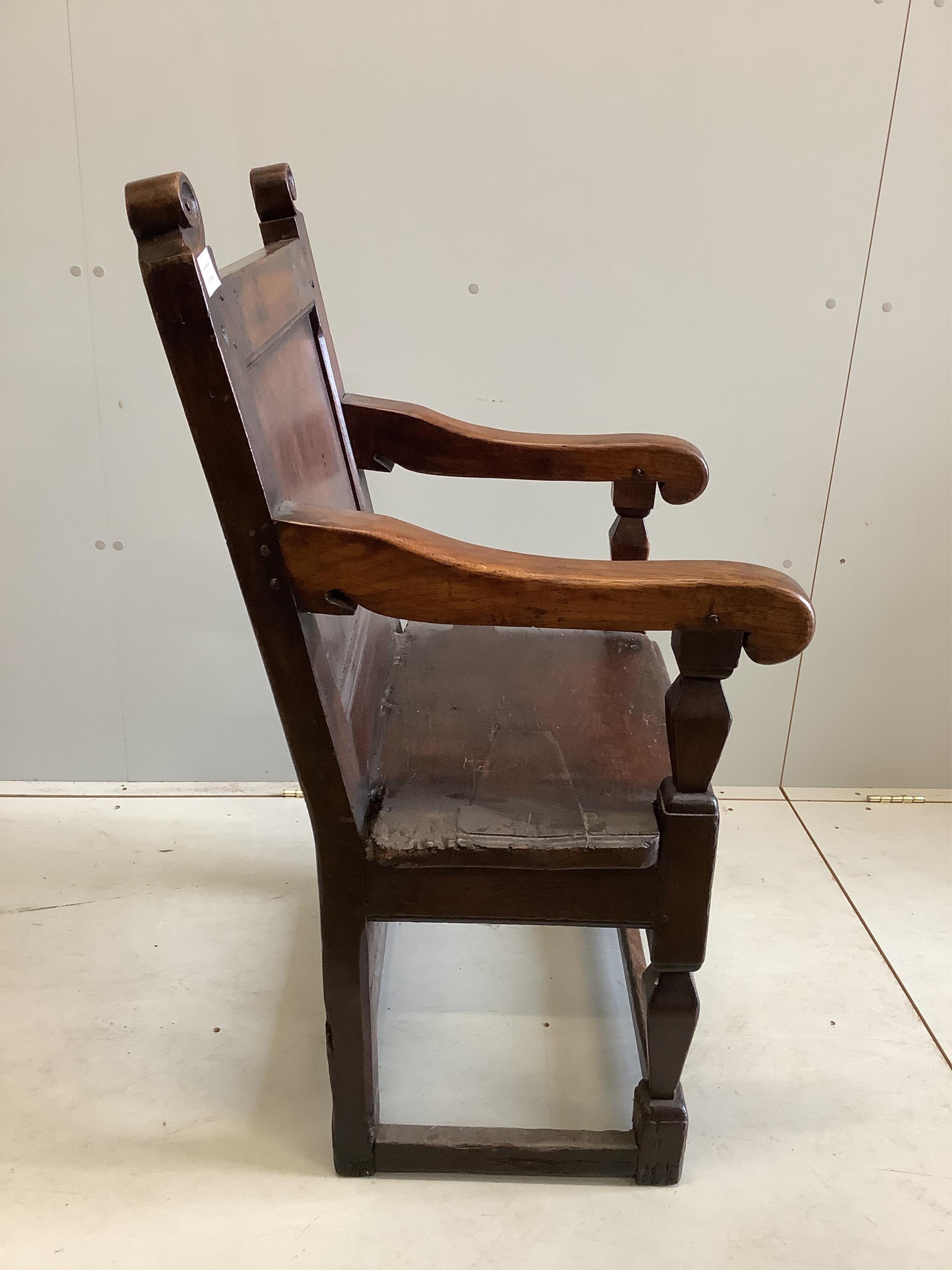 A 17th century oak wainscot elbow chair, width 58cm, depth 54cm, height 104cm. Condition - fair